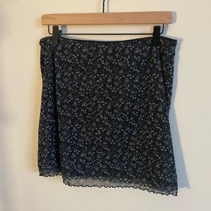 black mini skirt with teal floral pattern